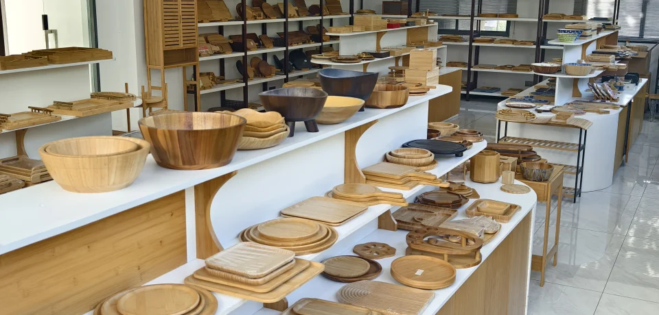Bambexa showroom display of various bamboo bowls, trays, and eco-friendly tableware