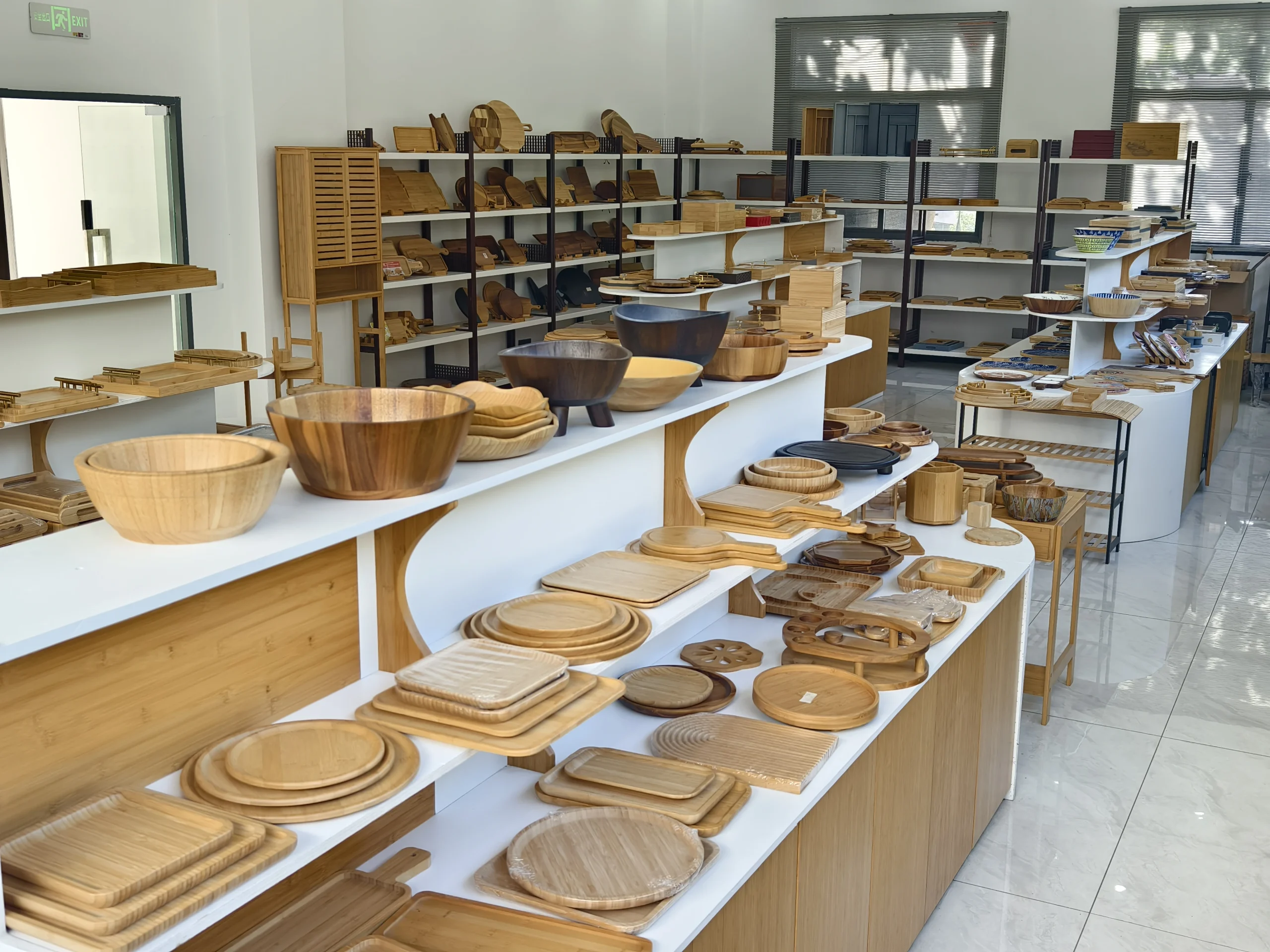 Bambexa showroom display of various bamboo bowls, trays, and eco-friendly tableware